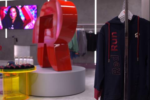 Interior of Red Run store, Liverpool One, showing a screen and products on display